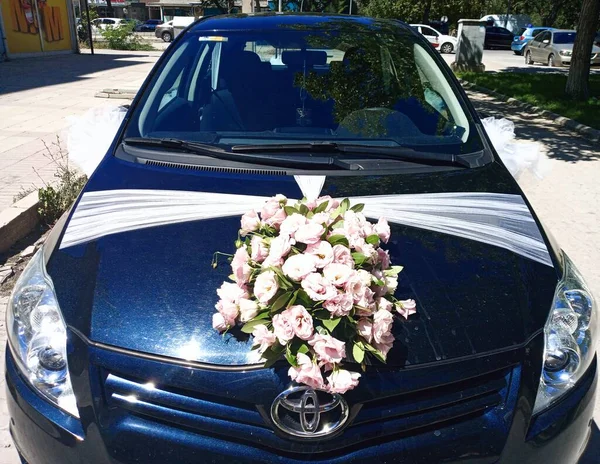 Car decorated for marriage. Wedding car. Toyota brand. Roses are decorated for wedding car. Car is ready for wedding.