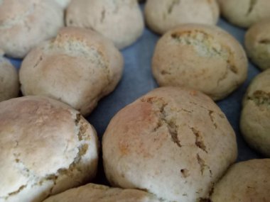 Cookies made with flour, sugar, vanilla, baking powder, egg and oil are on the tray. Baked cookies.
