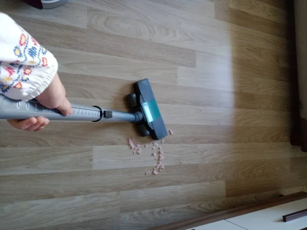 Woman Using Vacuum Cleaner — Photo