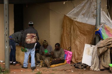 Homeless men in Johannesburg, living in appallingly improvised conditions