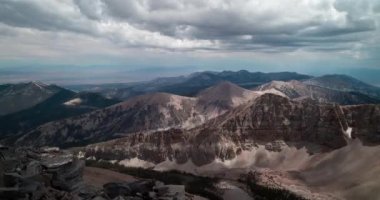 The Snake Mountain Range in Nevada viewed looking south from the summit of Wheeler Peak in Great Basin National Park. Time-lapse of stormy clouds passing through the sky on a summer day.
