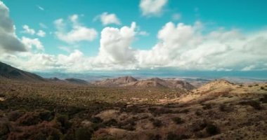 A time-lapse of clouds passing over the borderlands between Nogales, Arizona and Nogales, Mexico as seen from Duquesne Road in the Patagonia Mountains in the Coronado National Forest.