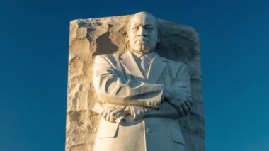 A time-lapse of the Martin Luther King Jr. memorial in Washington, D.C.. Evening shadows pass across the statue as the sun sets.