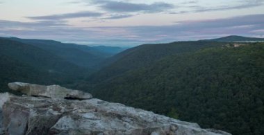 A time-lapse of the sunrise sweeping over the Red Creek Valley, as seen from the Rohrbaugh Cliffs in the Dolly Sods Wilderness, part of the Monongahela National Forest in West Virginia. Lions Head is seen in the distance.