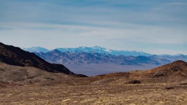 A time-lapse of evening light illuminating Telescope Peak and the Panamint Range, as seen from the South Nopah Range Wilderness in Tecopa, CA.