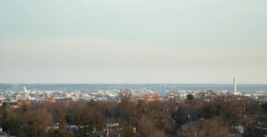 A sunset to night time lapse of the downtown  Washington, D.C. skyline and U.S. Capitol Dome as seen from a rooftop in Northwest DC