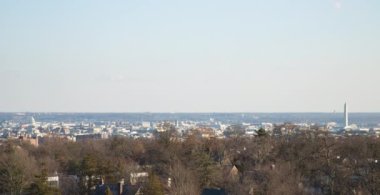 A sunset timelapse of the downtown  Washington, D.C. skyline, Washington Monument and U.S. Capitol Dome as seen from a rooftop in Northwest DC