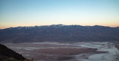 Morning sunshine illuminates the Panamint Mountains and Telescope Peak, as seen from Dante's View in Death Valley National Park, California in a time-lapse.
