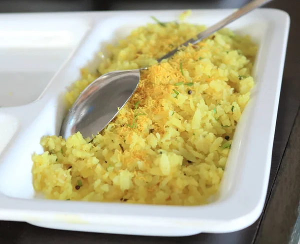 Indian Breakfast aalu Poha Also Know as kande Pohe made up of Beaten Rice or Flattened Rice.