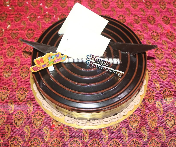 A dilicious birthday cake with red background.