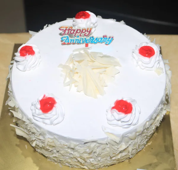 White colour anniversary cake with jelly.