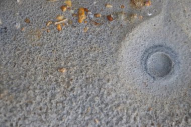 White sand with a pattern formed by rain drops