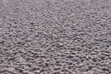 White sand with a pattern formed by rain drops