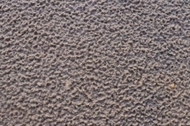 White sand with a pattern formed by rain drops