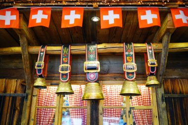Traditional Swiss Cowbells with flag of Zwitzerland