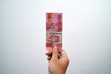 Hands and Rupiah isolated on a white background