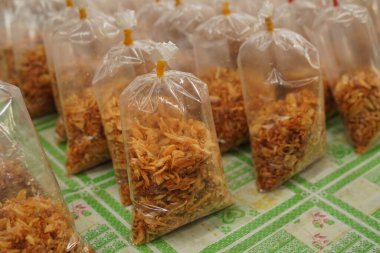 Close up Fried onions in plastic are sold at the local traditional market