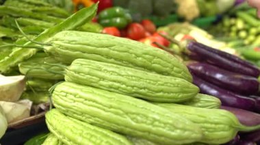 Batch of green fruits of bitter melon. Tumpukan Pare