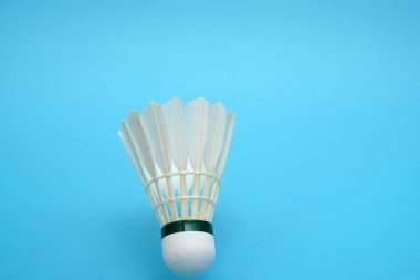 Shuttlecock badminton on blue background