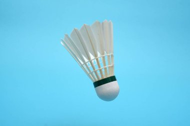 Shuttlecock badminton on blue background