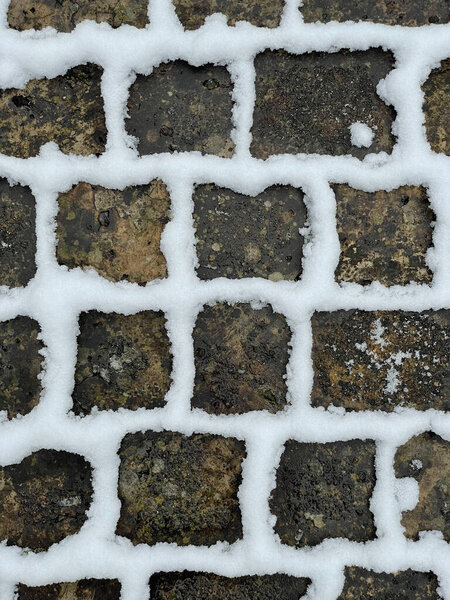 Paving stones with snow