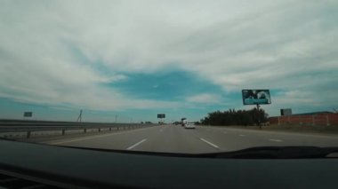 Car trip. Long road on a cloudy day. High quality 4k footage