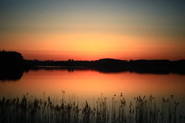 Gün batımı Fryland Gölü üzerinde, Zaman, Norveç