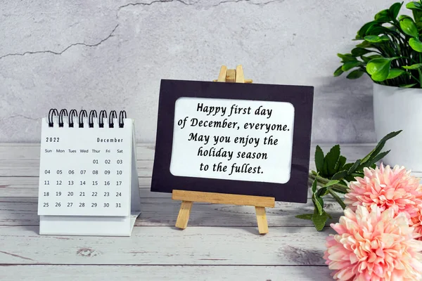 Motivational quotes on paper frame with December 2022 calendar - Happy first day of december everyone, may you enjoy the holiday season to the fullest.