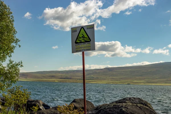 Ardahan, Turkey - July 2022 ; The sign It is dangerous to enter the water in ldr Lake