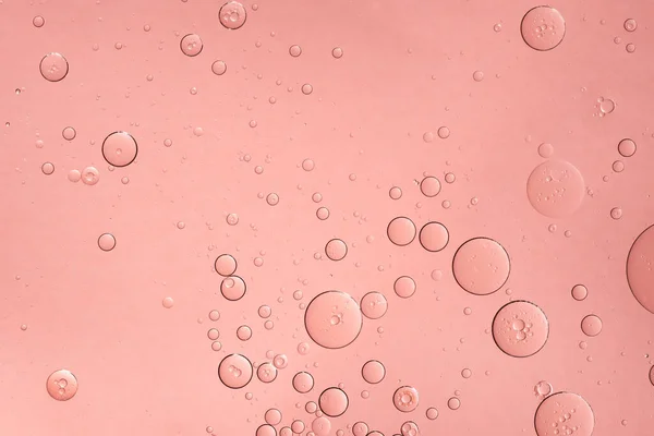 抽象的なピンクの油泡の背景 化粧品液体美容製品 — ストック写真