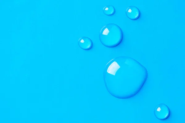 Vízcsepp Kék Háttérrel Absztrakt Gélcseppek Arcszérum Kozmetikumok — Stock Fotó