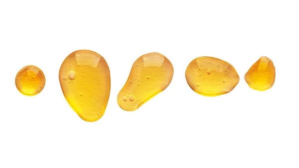 Χρυσοκίτρινο Αφηρημένο Λάδι Φυσαλίδες Σταγόνες Ορού Πρόσωπο Απομονώνονται Λευκό Φόντο — Φωτογραφία Αρχείου