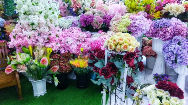 corner of the garden with colorful decorative flowers in pots for home table decoration