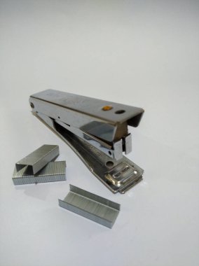 portrait display of Stapler and Staples isolated white background