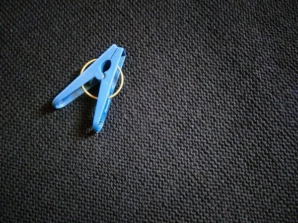 Blue Plastic Clothes Pegs Isolated Black Background — Zdjęcie stockowe