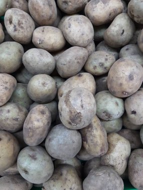 Patates. Masaüstünde bir fotoğraf. arka plan resmi. Hasta patates. Lezzetli vejetaryen yemekleri.