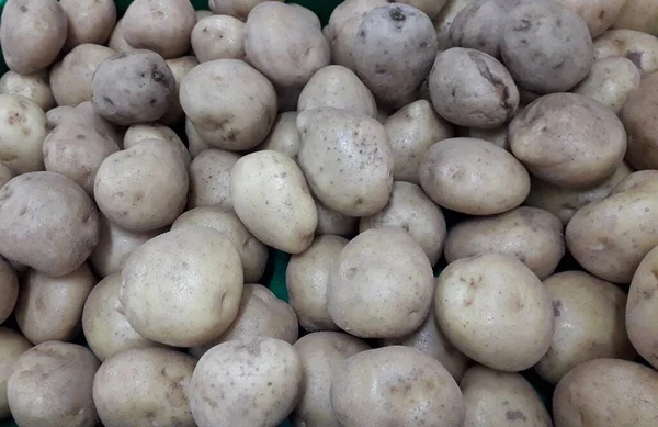 Patates. Masaüstünde bir fotoğraf. arka plan resmi. Hasta patates. Lezzetli vejetaryen yemekleri.