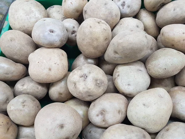 Patates. Masaüstünde bir fotoğraf. arka plan resmi. Hasta patates. Lezzetli vejetaryen yemekleri.