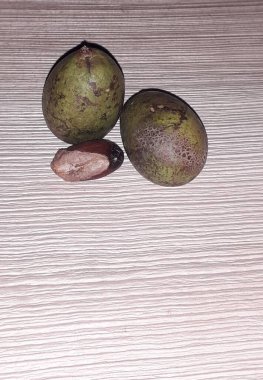 Matoa fruit from Papua, Indonesia. Matoa contains vitamins, nutrients and antioxidants. Served in wooden background, selective focus image, copy space.
