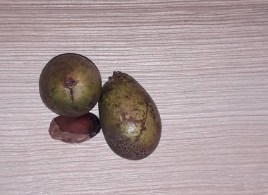 Matoa fruit from Papua, Indonesia. Matoa contains vitamins, nutrients and antioxidants. Served in wooden background, selective focus image, copy space.