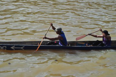 Banjarmasin, South Klimantan, Indonesia - August 7, 2022 : Floating Market Cultural Festival. The B6 jukung competition is a jukung rowing competition consisting of 6 rowers