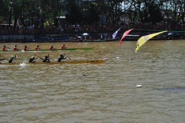 Banjarmasin, South Klimantan, Indonesia - August 7, 2022 : Floating Market Cultural Festival. The B6 jukung competition is a jukung rowing competition consisting of 6 rowers