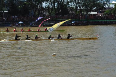 Banjarmasin, South Klimantan, Indonesia - August 7, 2022 : Floating Market Cultural Festival. The B6 jukung competition is a jukung rowing competition consisting of 6 rowers