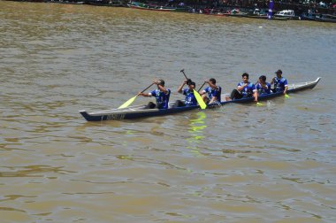Banjarmasin, South Klimantan, Indonesia - August 7, 2022 : Floating Market Cultural Festival. The B6 jukung competition is a jukung rowing competition consisting of 6 rowers