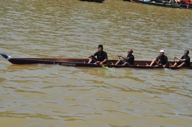 Banjarmasin, South Klimantan, Indonesia - August 7, 2022 : Floating Market Cultural Festival. The B6 jukung competition is a jukung rowing competition consisting of 6 rowers