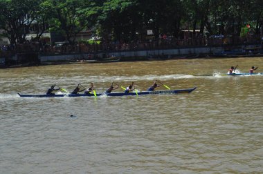 Banjarmasin, South Klimantan, Indonesia - August 7, 2022 : Floating Market Cultural Festival. The B6 jukung competition is a jukung rowing competition consisting of 6 rowers