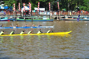 Banjarmasin, South Klimantan, Indonesia - August 7, 2022 : Floating Market Cultural Festival. The B6 jukung competition is a jukung rowing competition consisting of 6 rowers