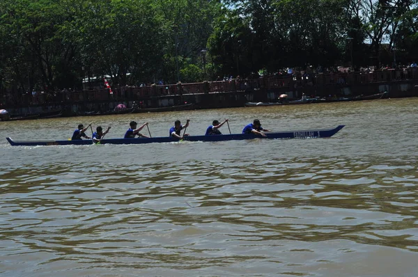 Banjarmasin, South Klimantan, Indonesia - August 7, 2022 : Floating Market Cultural Festival. The B6 jukung competition is a jukung rowing competition consisting of 6 rowers