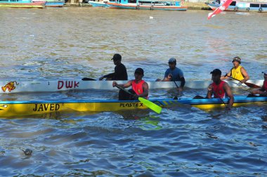 Banjarmasin, South Klimantan, Indonesia - August 7, 2022 : Floating Market Cultural Festival. The B6 jukung competition is a jukung rowing competition consisting of 6 rowers
