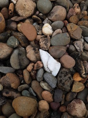 white stone between blackstone background